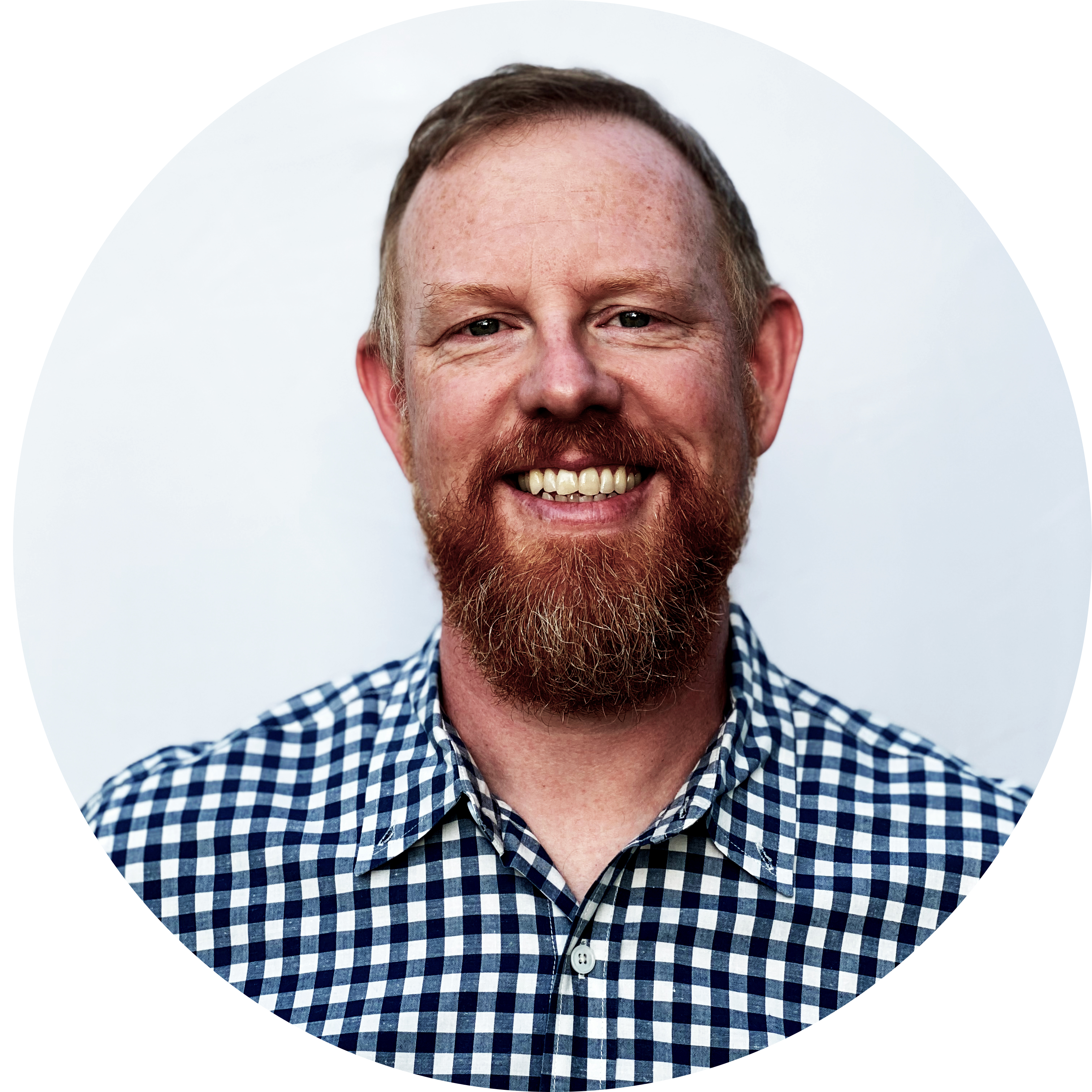Portrait of Matthew Brown wearing a shirt and smiling
